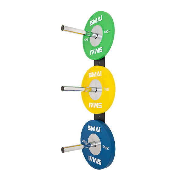 The SMAI Wall mounted Bumper Plate Storage with Chrome Pegs efficiently organizes three sets of colored weight plates—green (top), yellow (middle), and blue (bottom)—each labeled "SMAI" with their corresponding weights.