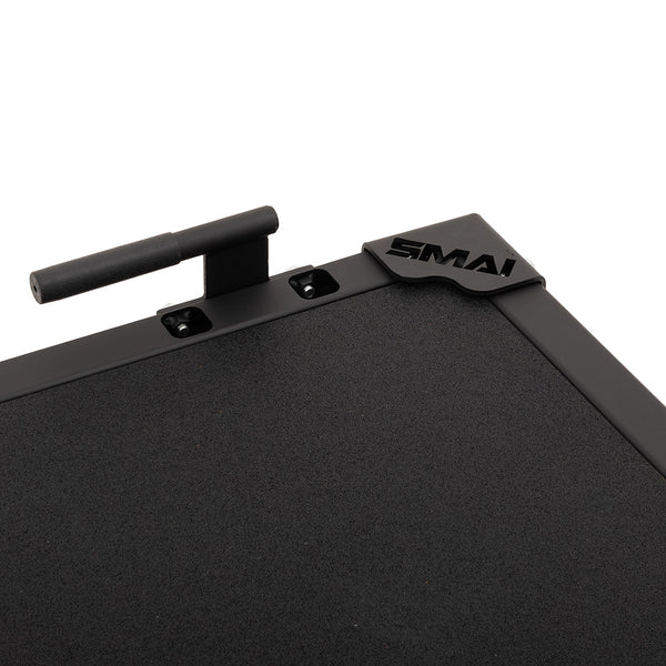 Close-up of the SMAI Weight Lifting Platform - Black, showing its corner with a small handle on top—ideal as durable commercial-grade gym equipment or for weightlifting.