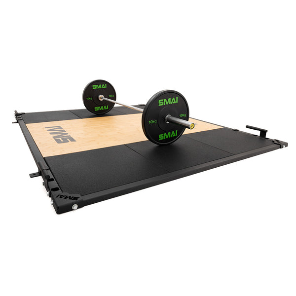 The SMAI Weight Lifting Platform - Black supports strength and Olympic lifting with commercial-grade durability, and is shown holding a barbell with green and black plates, making it ideal for professional gym setups.