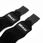 A pair of black SMAI Wrist Support Wraps for weightlifting features flat ends, Velcro straps, and white branding. Made from soft, flexible material for excellent wrist protection during intense gym workouts.