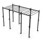 The Rig - 4 Squat Cells with Monkey - X-Frame by No Sync To Channel Engine is a sleek black metal gym setup made from high-gauge steel. It boasts a rectangular frame equipped with multiple pull-up bars and adjustable components, making it ideal for strength training in commercial gyms. The freestanding structure is presented against a white backdrop.