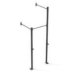 The Wall Mounted Rig - 1 Squat Cell with Bridge - X-Frame by No Sync To Channel Engine is a modular black pull-up bar designed for wall mounting, featuring two vertical posts and a horizontal bar. It offers multiple holes for height adjustment and includes two hooks to secure a barbell, making it perfect commercial equipment for strength training exercises.