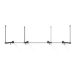 A minimalist black wall-mounted rig named the "Wall Mounted Rig - 2 Squat Cell with Bridge - X-Frame" by No Sync To Channel Engine features a modular design, with four rectangular brackets evenly spaced along the horizontal bar. This setup is perfect for supporting lighting or other fixtures and stands out elegantly against a white background.