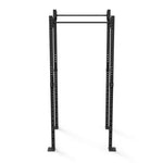 The Rig - 2 Squats Cells - X-Frame, from the brand No Sync To Channel Engine, is crafted from high-gauge steel tubing. This black metal squat rack features adjustable holes for customizable height. It includes two vertical posts linked by a horizontal pull-up bar, suitable for various strength training exercises in commercial gym settings, set against an empty white background.