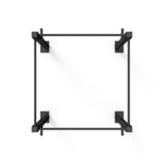 A top view of the minimalist black No Sync To Channel Engine Rig - 2 Squat Cells - X-Frame, constructed from high-gauge steel tubing. Its elegant design includes four corners linked by horizontal and vertical bars, making it ideal for commercial gym use, all set against a plain white background.