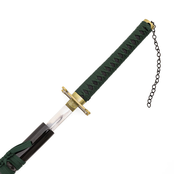 A close-up of the SMAI Shackled Emerald Anime Display Katana being partly drawn from its black scabbard, revealing a green-wrapped handle with black diamond patterns, a gold-toned guard, and a chain on the pommel.