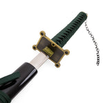A close-up of the SMAI Shackled Emerald Anime Display Katana, featuring a green-wrapped handle, gold and black rectangular handguard, and a black sheath with an attached chain.