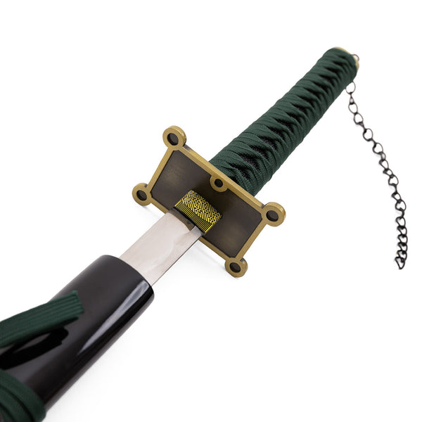 A close-up of the SMAI Shackled Emerald Anime Display Katana, featuring a green-wrapped handle, gold and black rectangular handguard, and a black sheath with an attached chain.