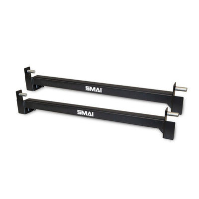 Two X-Frame Cage Spotting Rails from No Sync To Channel Engine, featuring black coloring and modular design for versatility and ease of use. They include metal pegs for secure barbell safety and are positioned parallel to each other on a white background.
