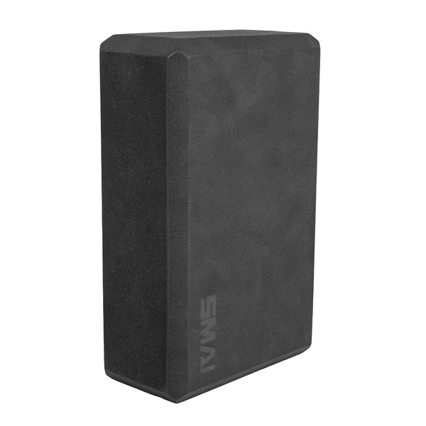 The SMAI Yoga Block - Black is a rectangular, high-density foam accessory with slightly beveled edges and "SMAI" branding, ideal for yoga, Pilates, or exercise routines.