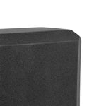Close-up view of the SMAI Yoga Block - Black, featuring a beveled edge and textured, high-density foam surface with a geometric shape, displayed against a white background.