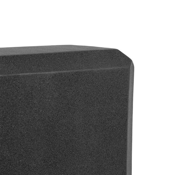Close-up view of the SMAI Yoga Block - Black, featuring a beveled edge and textured, high-density foam surface with a geometric shape, displayed against a white background.