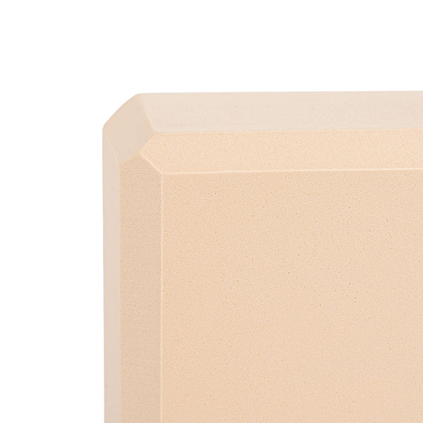 Close-up of the SMAI Yoga Block - Camel, a beige rectangular foam block with beveled edges and a smooth matte finish, shown against a white background.