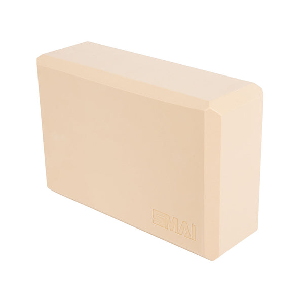 The SMAI Yoga Block - Camel is a beige, rectangular yoga accessory made from high-density foam with beveled edges and embossed branding, shown against a white background.