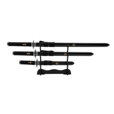 The SMAI Ninja 3pc Sword & Stand features three collectible black swords with decorative hilts and gold emblems, elegantly arranged on a black stand against a white background.