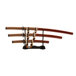 The SMAI Samurai 3pc Sword & Stand - Brown set includes a katana, wakizashi, and tanto with ornate handles and brown sheaths, beautifully displayed on a black wooden stand against a white background.