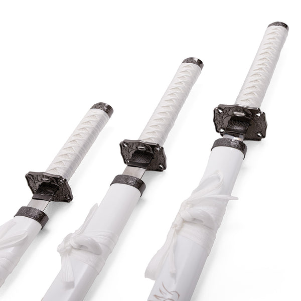 The SMAI White Samurai 3pc Sword & Stand features three white katanas of different lengths, each with ornate black guards and matching white scabbards tied with white cord—perfect for display.