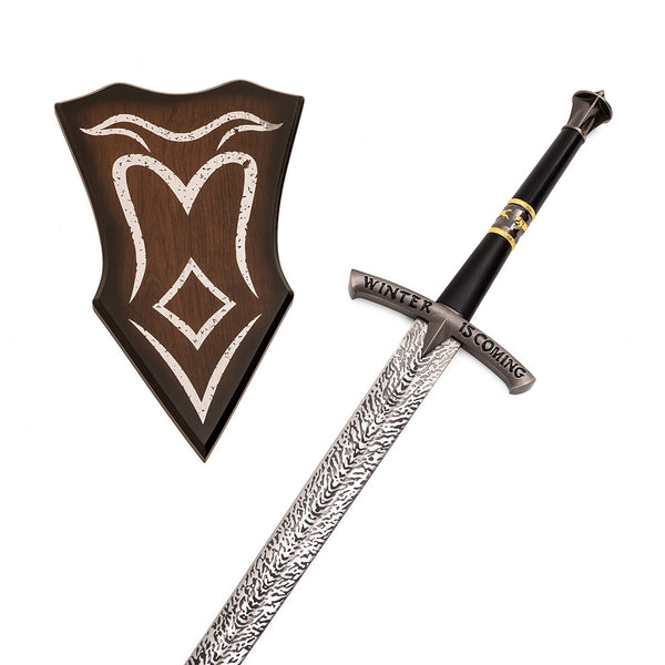 The SMAI Medieval Display Broadsword - Blizzard features a patterned blade and "Winter Is Coming" on the guard, shown beside a wooden shield with silver detailing.