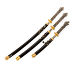 The Daisho - Highlander Display by SMAI features three Japanese swords with dragon head hilts, black and gold scabbards, and ornate gold detailing on the guards and tips, displayed side by side.
