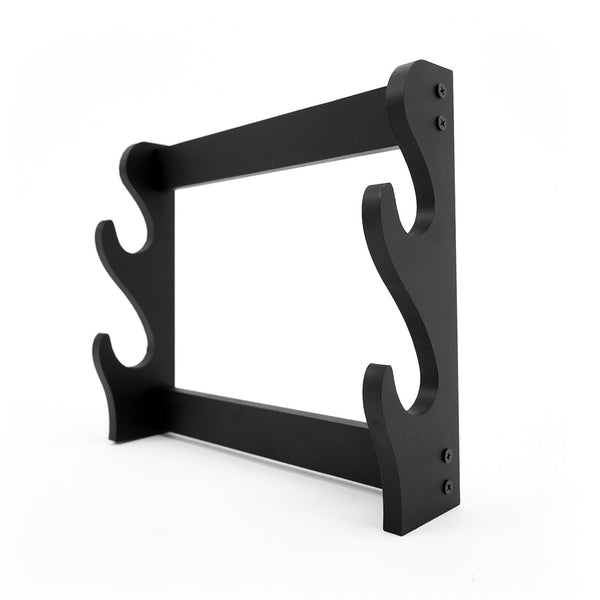 The SMAI Double Sword Display Wall Mounted stand is black, made of wood or metal, and holds 2 swords. It features curved side supports, a rectangular frame, and visible side screws for secure wall mounting.