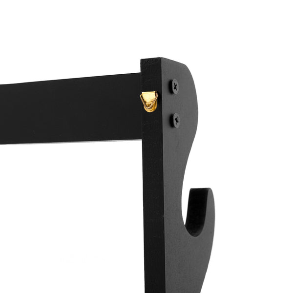 Close-up of the SMAI 4 Sword Display Wall Mounted in black wood, featuring two black screws and a gold-colored hanging hook at the top corner, shown against a white background.