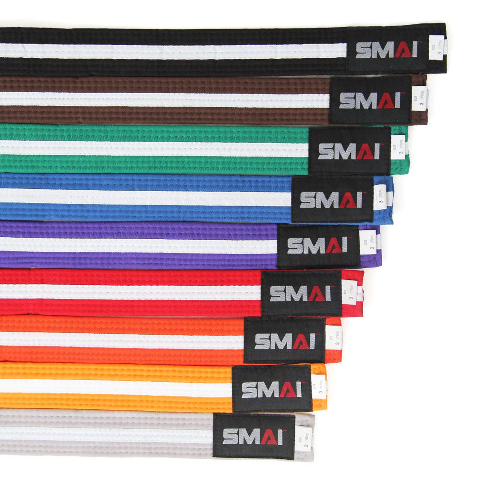 This set includes eleven poly-cotton SMAI martial arts belts, featuring colors from darkest to lightest: black, brown, red, green, blue, purple, orange, yellow, and three Martial Arts Belt - White Stripe. Each belt is 100% colorfast and marked with the SMAI label.