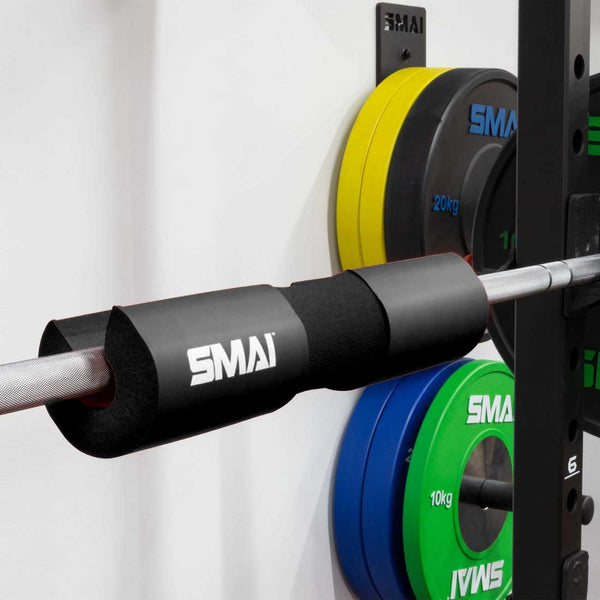 SMAI barbell pad / hip thruster pad in black foam attached to a barbell