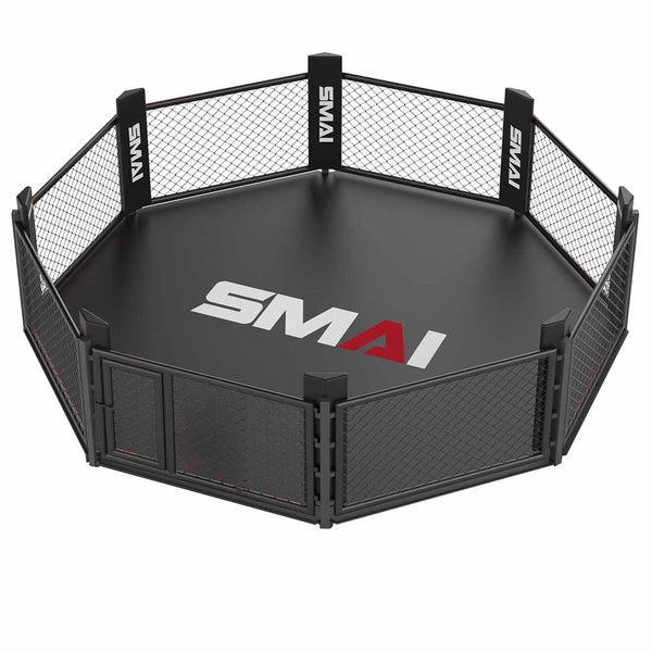 The SMAI MMA Cage - 5m Fold Away is a black octagonal cage with mesh fences, padded posts, and a front center door. "SMAI" appears in white and red on the mat. Its fold-away design offers space-saving convenience.
