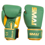 The Gold Series Boxing Glove by SMAI in green and gold is featured, displaying both palm and knuckle sides. The gloves include bold "SMAI" and "GOLD" branding, a Velcro wrist strap for optimal wrist support, and showcase their design from multiple angles.