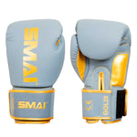 A pair of light blue and gold Gold Series Boxing Gloves by SMAI, displayed from the front and back, featuring Velcro wrist straps for enhanced wrist support and stitched detailing.