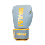 A light blue boxing glove with gold "SMAI" branding on the front and wrist strap, offering superior shock protection and wrist support, shown against a white background.