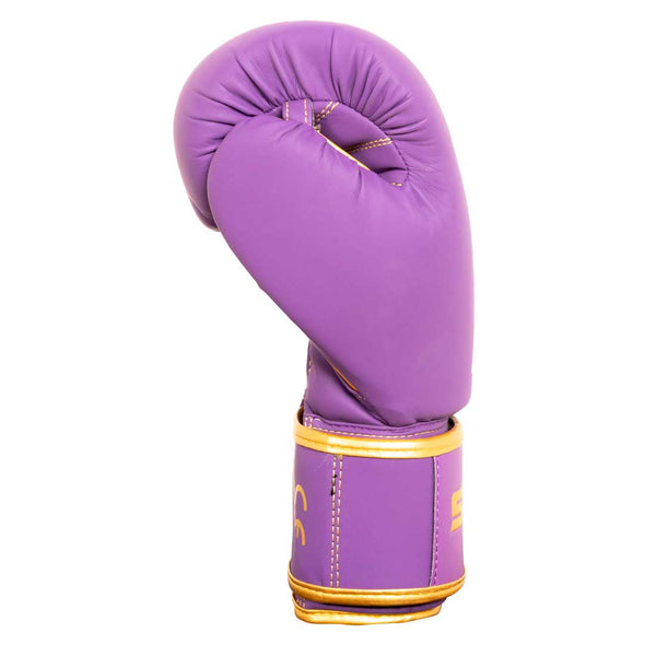The SMAI Gold Series Boxing Glove in Purple/Gold, featuring premium gold trim and stitching for enhanced style and built with advanced wrist support and shock protection, is displayed standing upright against a white background.