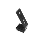 A black L-shaped bracket, featuring three circular holes and resembling a SMAI Fixed Barbell Rack Spare J-Hook Replacement Part, stands upright on a white background.
