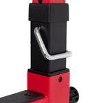 Close-up of a Sale Item Portable Squat Stand, featuring red and black adjustable metal supports with a silver locking pin inserted through a hole, highlighting its potential use for fitness or industrial applications.