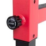 Close-up of a red adjustable mechanism on the Portable Squat Stand - Red / Black (Pair) by Sale Item. The black knob features a grip with white text stating "TO ADJUST LOOSEN THEN PULL," along with directional arrows, providing adjustment instructions essential to the squat stand's functionality.