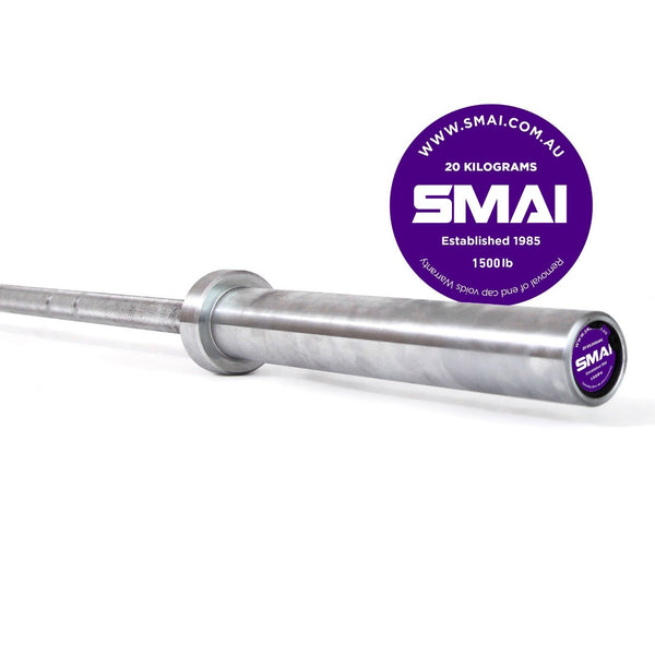 Enhance your Olympic lifting setup with the silver 20-kilogram barbell, featuring purple Sale Item branding on the end cap and a remarkable capacity of 1500 lb. The background showcases a clean white design with a purple circle highlighting the website URL and "Established 1985.