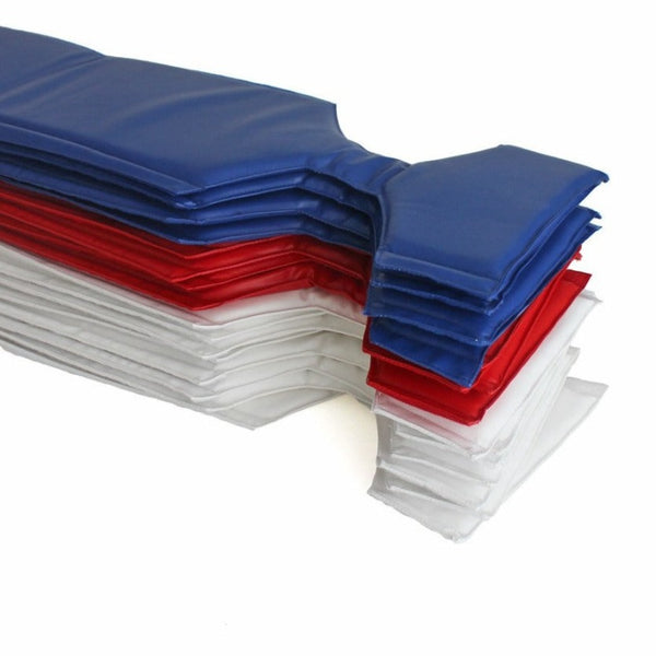 A stack of Turnbuckle Covers from SMAI in blue, red, and white is arranged in alternating layers like safety padding. The covers appear firm and are neatly piled in a sequence showcasing a stair-like pattern reminiscent of boxing ring accessories.