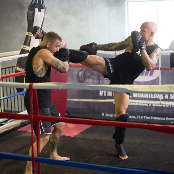 Men fighting using Elite85 Kickboxing Combo Kit