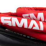 Close up of 6-metre tightly coiled red, black and white boxing ropes 