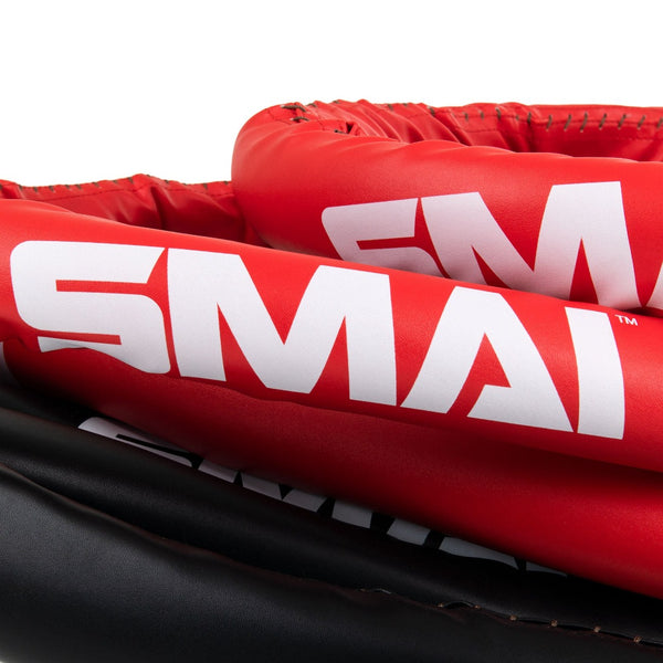 Close up of 6-metre tightly coiled red, black and white boxing ropes 