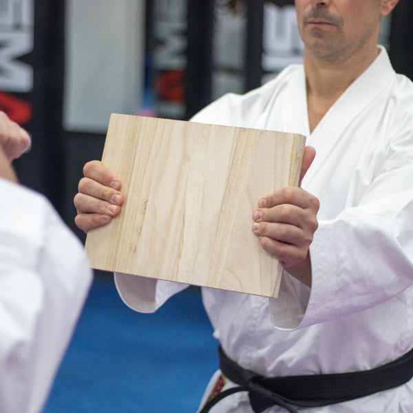 Paulownia Wood Break Boards - 20 pk of 1.5cm Man holding board