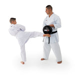 Pad - Shoc Tec Round Man holding pad while boy kicks it
