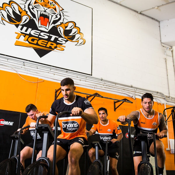 Wests Tigers players using the SMAI Air Fit 2.0 Bike Assault Bike 