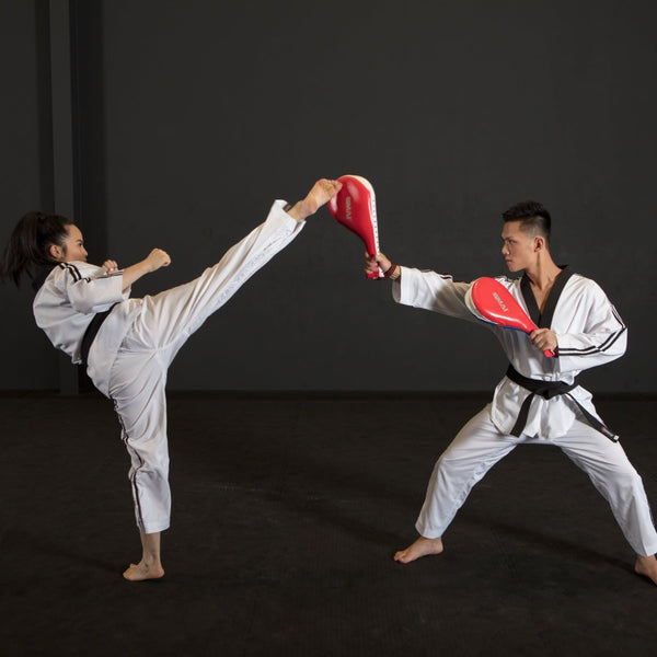 Woman kicking TKD Clapper