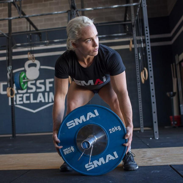 Jessica Coughlan Crossfit Games athlete lifting SMAI Competition Bumper Plate.