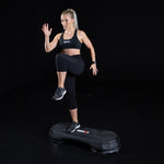 Woman using SMAI Aerobic Stepper black