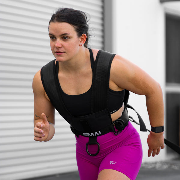 Julia Hannaford crossfit athlete pulling sled with sled harness
