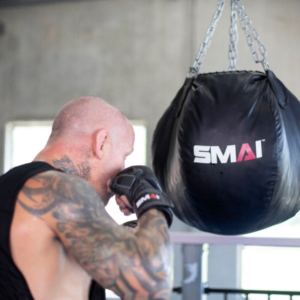 Man using SMAI Elite85 MMA Hybrid Sparring Gloves 7oz