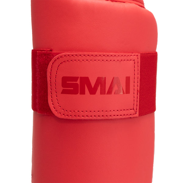 KARATE SHIN INSTEP GUARD - WKF APPROVED Red Close up of Velcro strap with SMAI logo