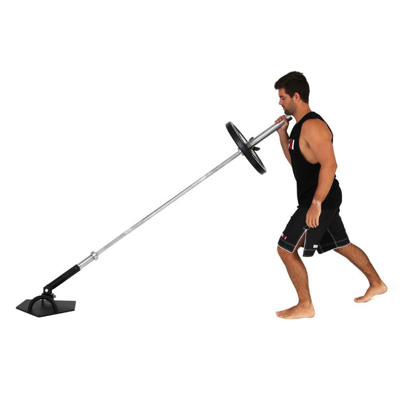 Man using SMAI Core Trainer Landmine pushing a 20kg barbell with a bumper plate 